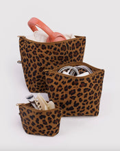 Three leopard-print pouches in different sizes