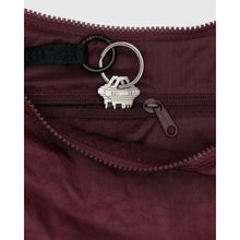 inside view of baggu medium crescent bag. small zipper pocket and key chain 