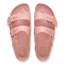 Pair of pink sandals with a buckle 
