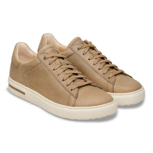 Pair of tan sneakers 