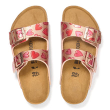 Pair of kid's sandals with heart pattern and bronze buckles