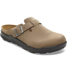 Brown clog shoe with a buckle