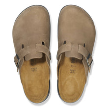 Pair of light brown leather clogs with buckles