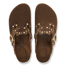 A pair of Birkenstock brown suede clogs with gold-tone metal studs and buckles