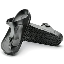 Black EVA sandals with a textured sole 