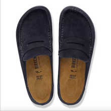 A pair of Birkenstock loafer clogs in navy blue suede