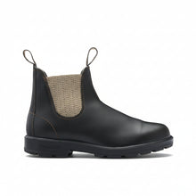 A leather Chelsea boot with a beige woven elastic side panel and pull tabs