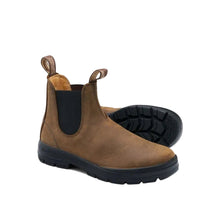 A brown leather Blundstone Chelsea boot with a black elastic side panel and a black sole