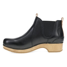 A black leather Chelsea ankle boot with a natural wedge heel and pull tabs