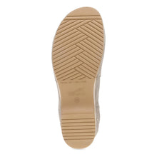 The tan rubber outsole of the chelsea boot