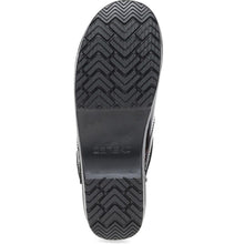 The black rubber outsole of a clog, showing a textured tread pattern