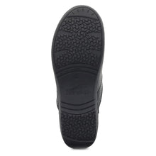 Black rubber sole of a black clog