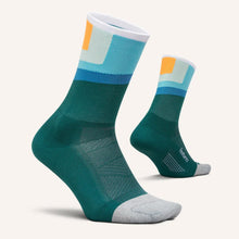 Pair of green socks with multicolor pattern 