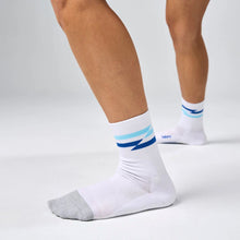 White socks with blue and gray accents worn by a person 