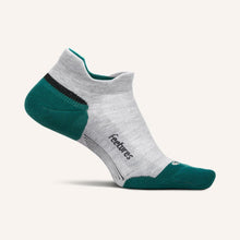 Gray and green ankle sock with 'feetures' branding 