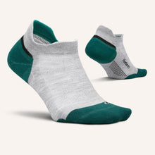 Gray and green socks with a close-up of the sole
