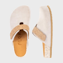Pair of white clogs with cork velcro strap 