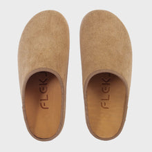 A pair of tan slip-on clogs 