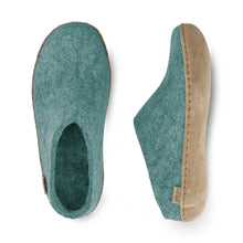 A pair of slip-on wool clogs