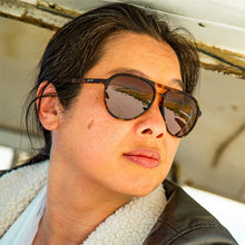 Person wearing sunglasses with a blurred background