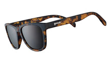 Sunglasses with tortoiseshell frame and dark lenses