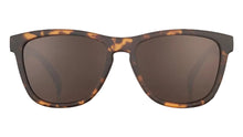 Sunglasses with tortoiseshell frame and dark lenses