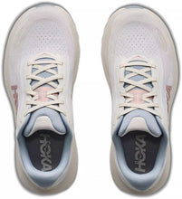 A pair of Hoka running shoes shown from a top-down view, featuring a white mesh upper, light blue lining, and pale pink accents on the laces and side details.