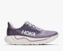 Purple running shoe with white sole 