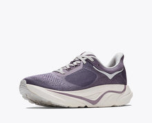Purple running shoe with white sole