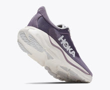 A Hoka running shoe in purple and white