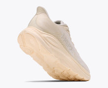 Light beige running sneaker with a cream sole 