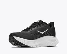 Black running shoe with white sole 