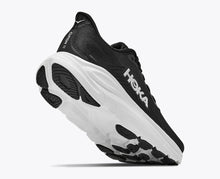 Black running shoe with white with black  accent grip