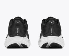 Black running shoes with white soles