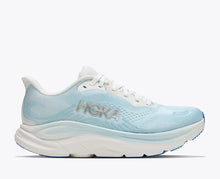 Light blue woman's running shoe with white sole 
