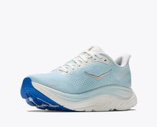 Light blue running shoe with white sole 