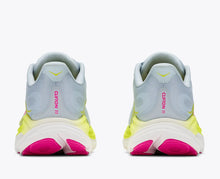 Pair of running shoes with light blue, yellow, and pink accents