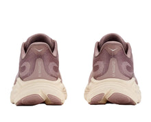 A pair of running shoes shown from the back, featuring a dusty mauve upper and a thick cream-colored midsole