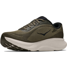 An athletic running shoe featuring an olive green mesh upper, a thick cream midsole, and a dark navy blue logo on the side.