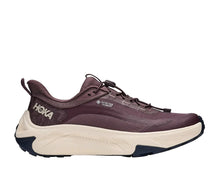 A Hoka trail running shoe in a deep plum purple and cream colorway, featuring a thick cream midsole and a dark purple upper with a visible Hoka logo on the heel.