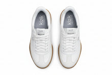 Pair of white sneakers with 'kizik' branding 