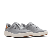 Pair of gray sneakers with white soles 