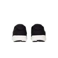 Black sneakers with white soles 