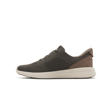 Men's low-top athletic Kizik sneaker, featuring a dark brown knit upper, a brown heel tab, and a thick off-white midsole.