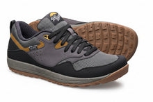 Gray and black sneaker with brown sole 