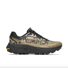 A gold and black running shoe, with a floral pattern. The shoe features a breathable mesh upper, a thick cushioned midsole, with vibram soles.