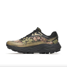 A gold and black running shoe, with a floral pattern. The shoe features a breathable mesh upper, a thick cushioned midsole, with vibram soles.