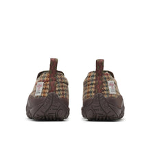 A slip-on shoes featuring a brown leather toe cap, a brown and dark brown houndstooth patterned tweed heel, and a dark brown sole.