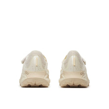 Pair of beige sneakers shown from the back