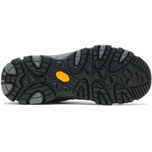 A close-up view of a black hiking boot Vibram sole, showing the tread pattern